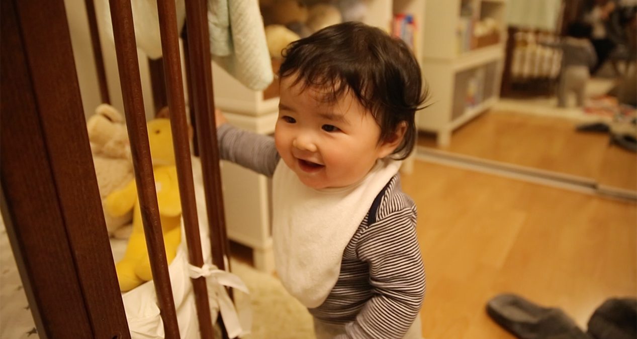 Pulling himself up to stand!