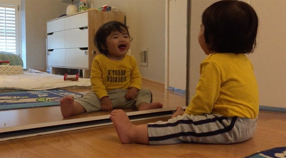 Cracking himself up in the mirror!